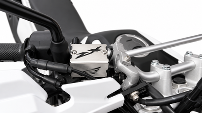 PROTECTOR BOMBA FRENO DELANTERO HONDA TORNADO 250